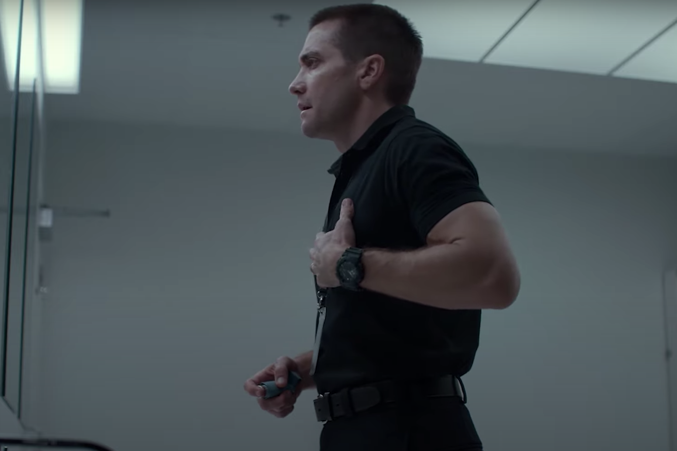 Joe Baylor looking into the bathroom mirror wearing his G-Shock in The Guilty.