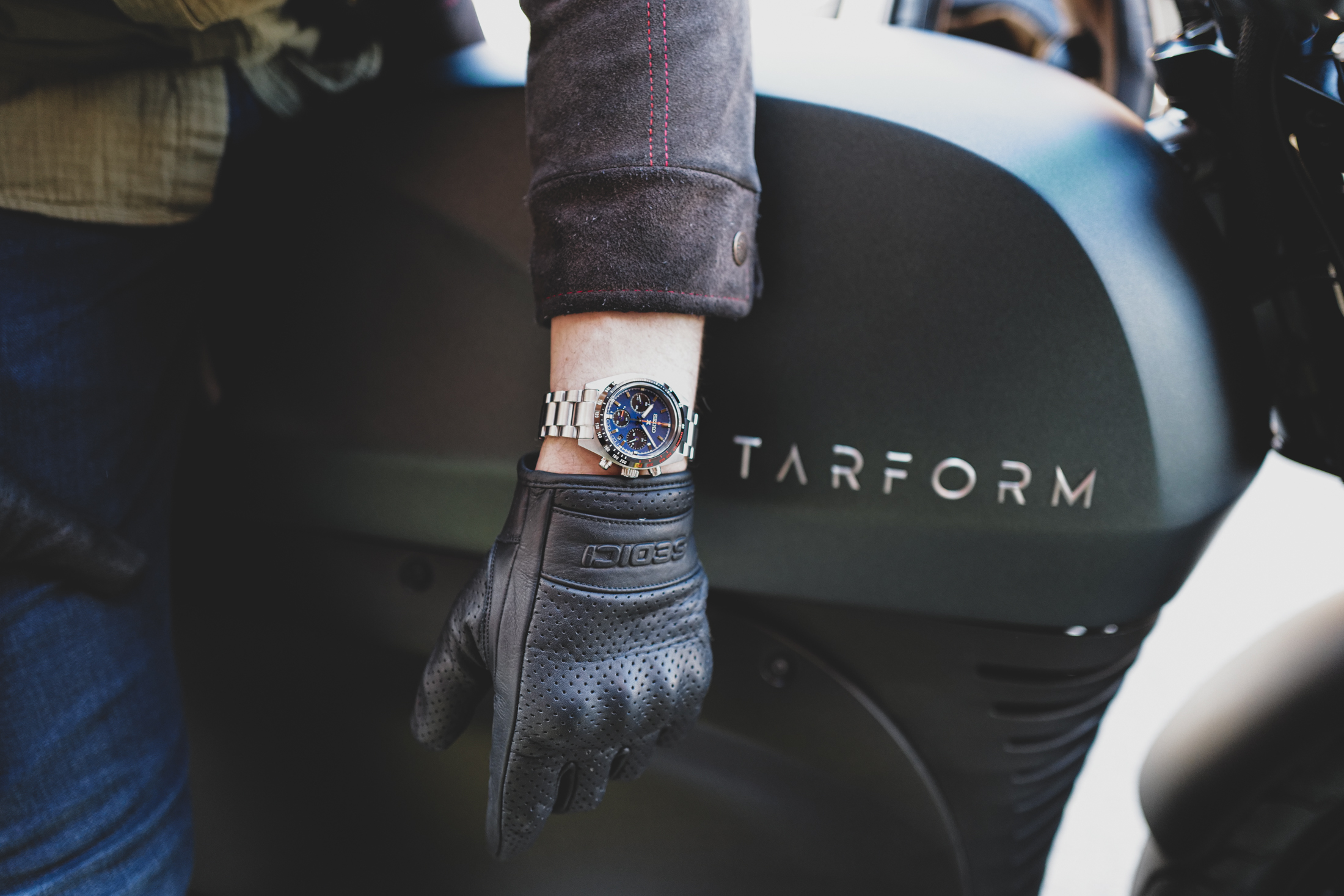 Seiko Solar Speedtimer on wrist in front of Tarform bike