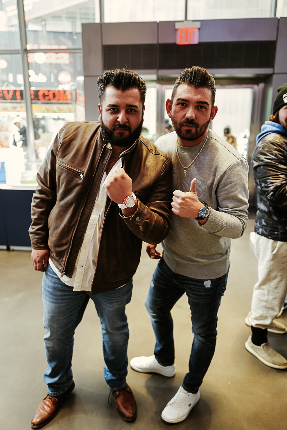 two men showing their new watches
