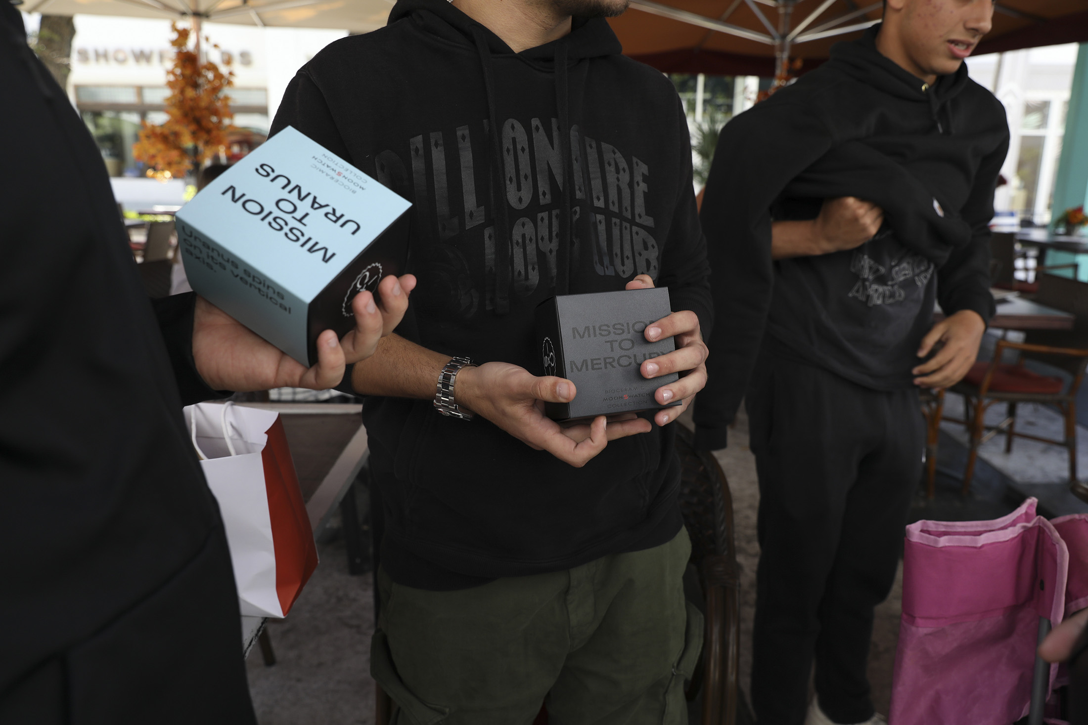 the moonswatch in hand