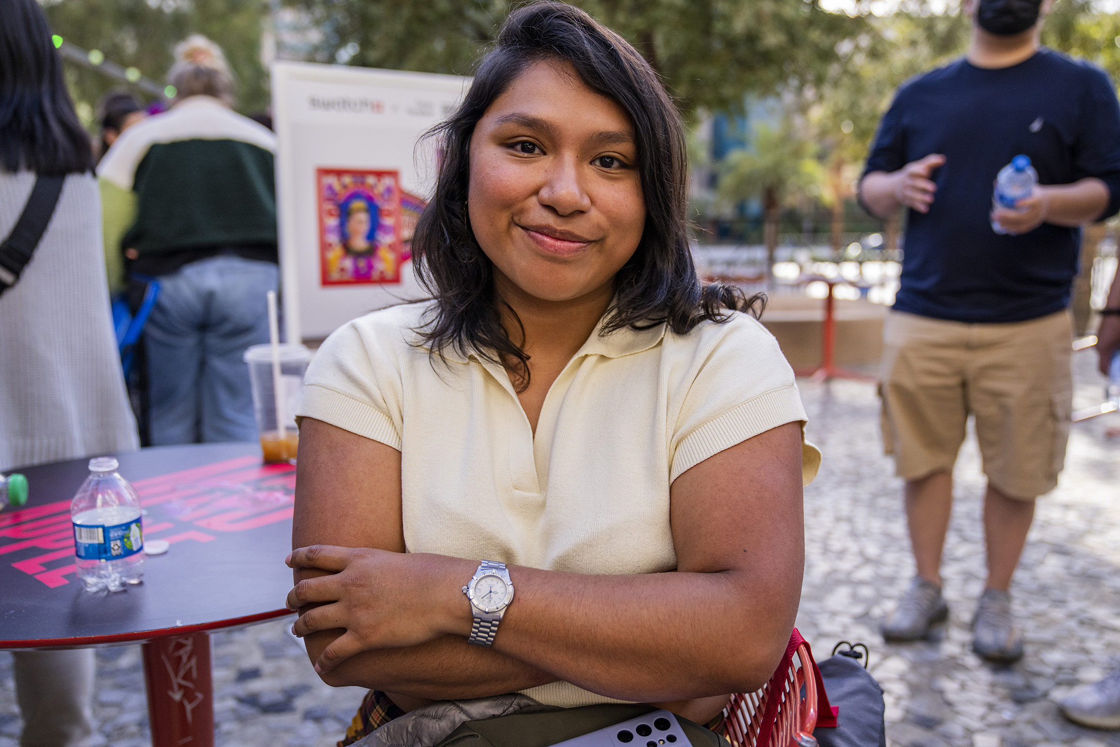 A woman poses while wearing a watch.