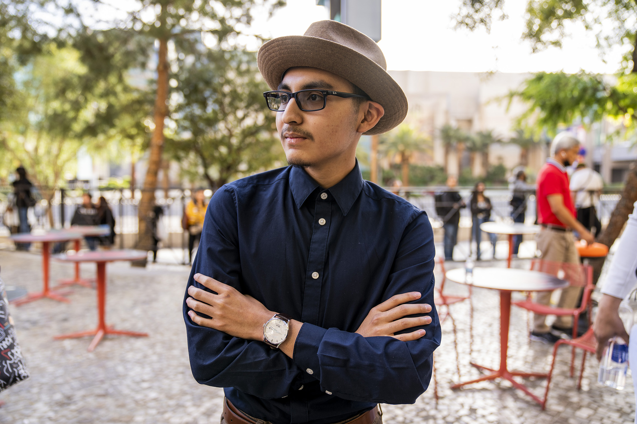 A man poses while wearing a watch.