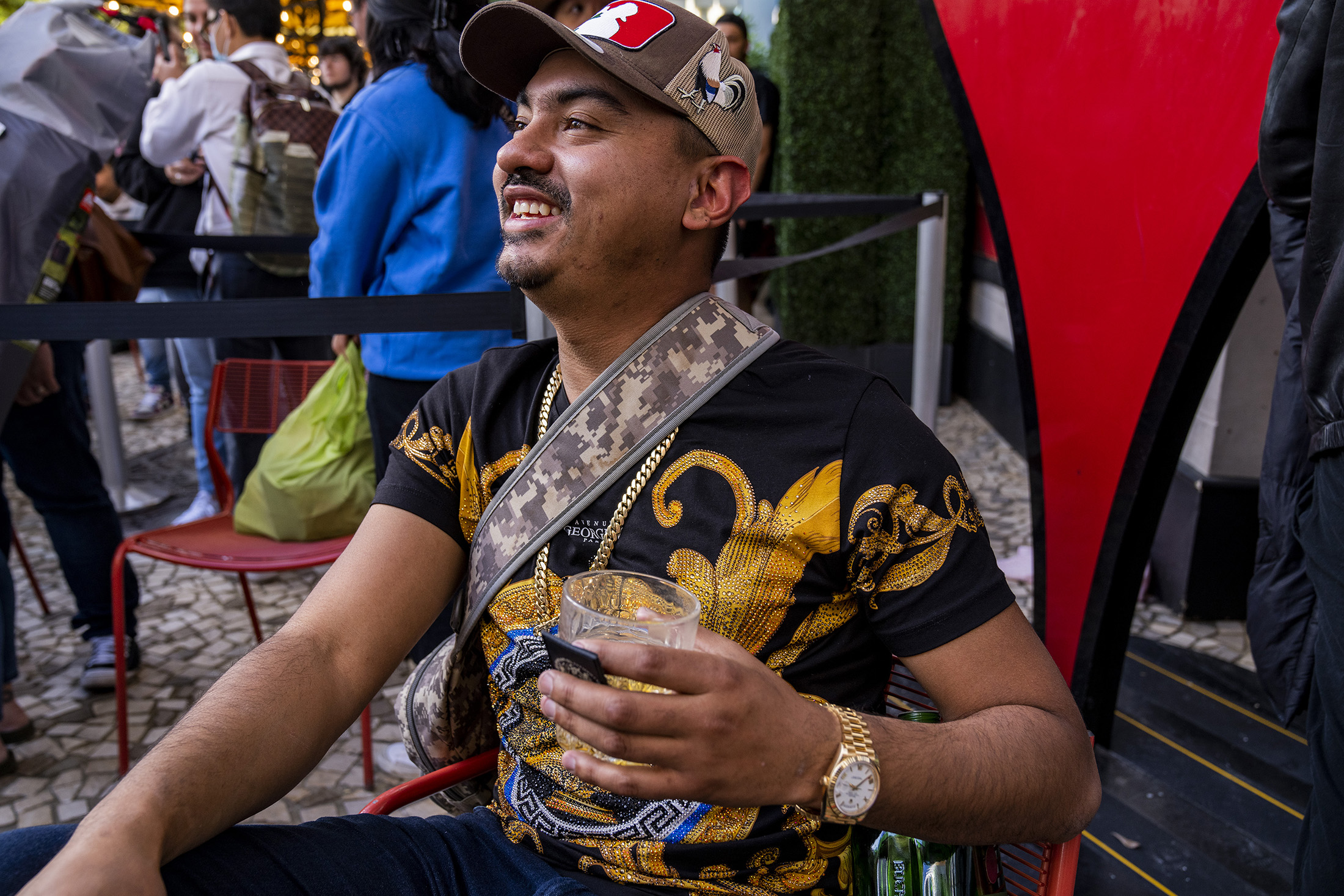 A man poses while wearing a watch.