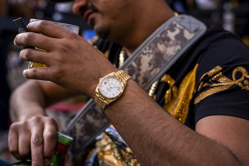 A man wears a watch. 