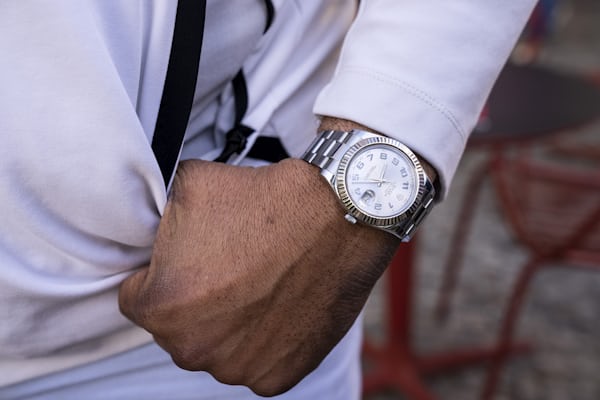 A man wears a watch. 