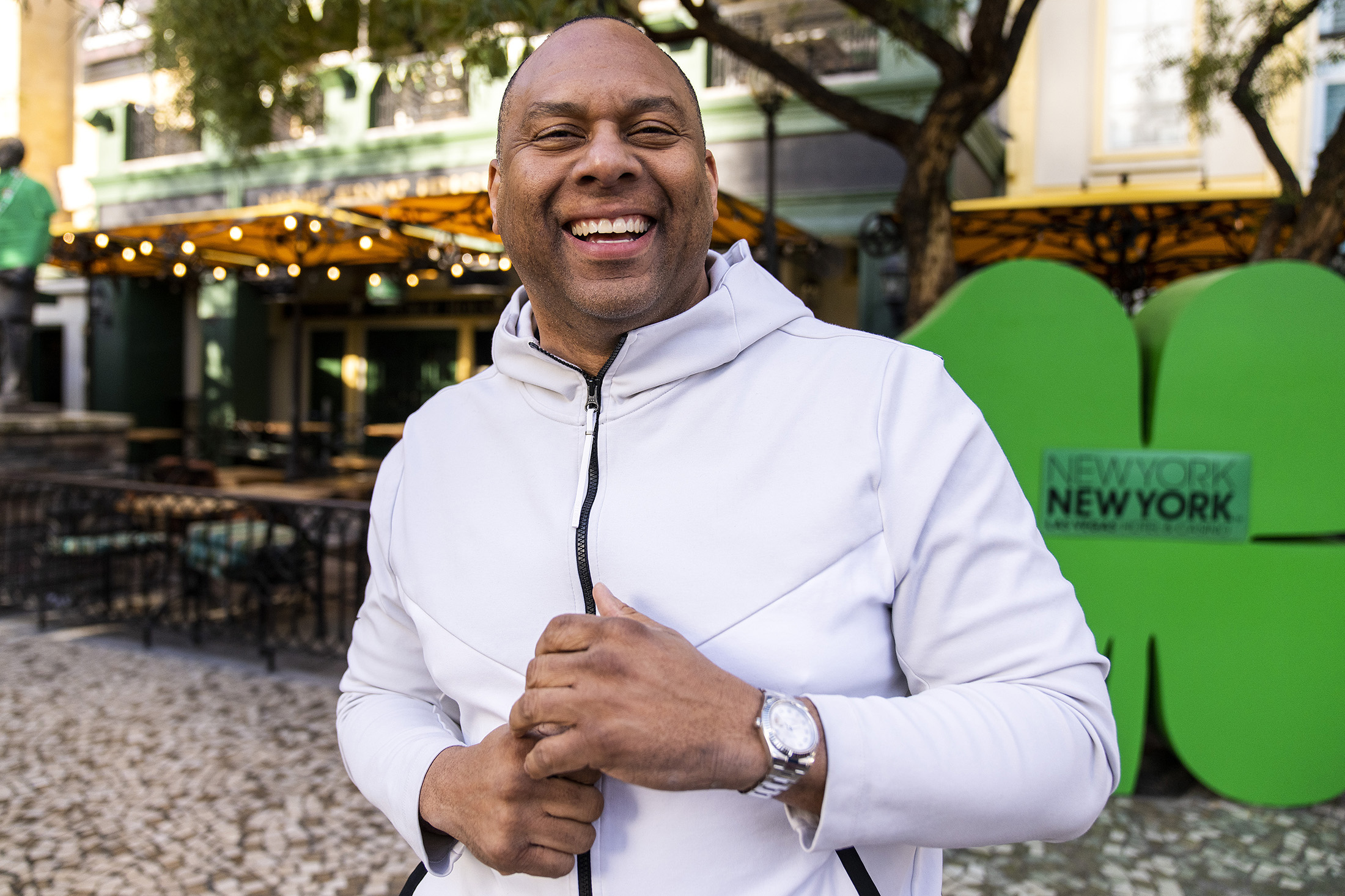 A man poses while wearing a watch.