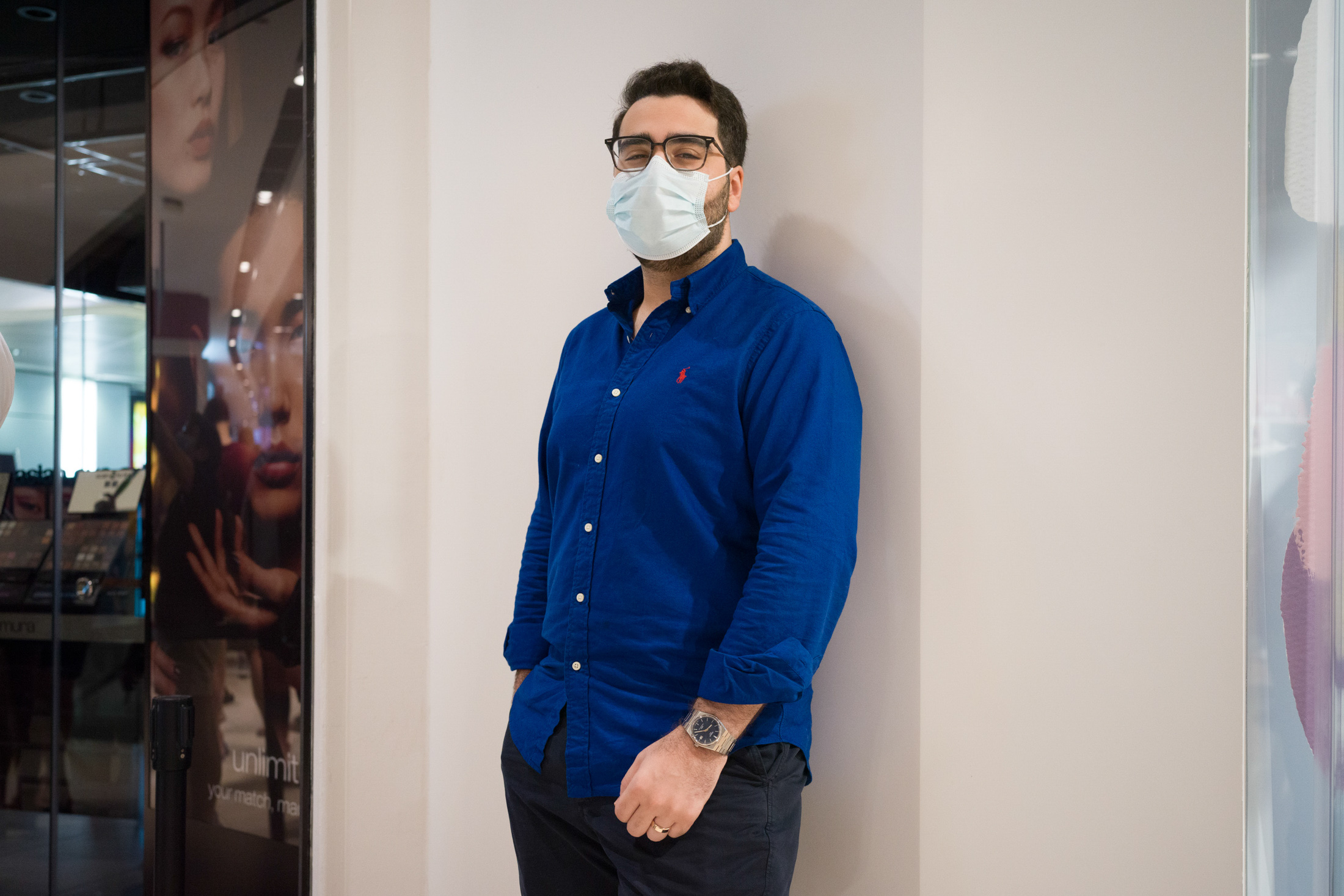 A man poses while wearing a watch.