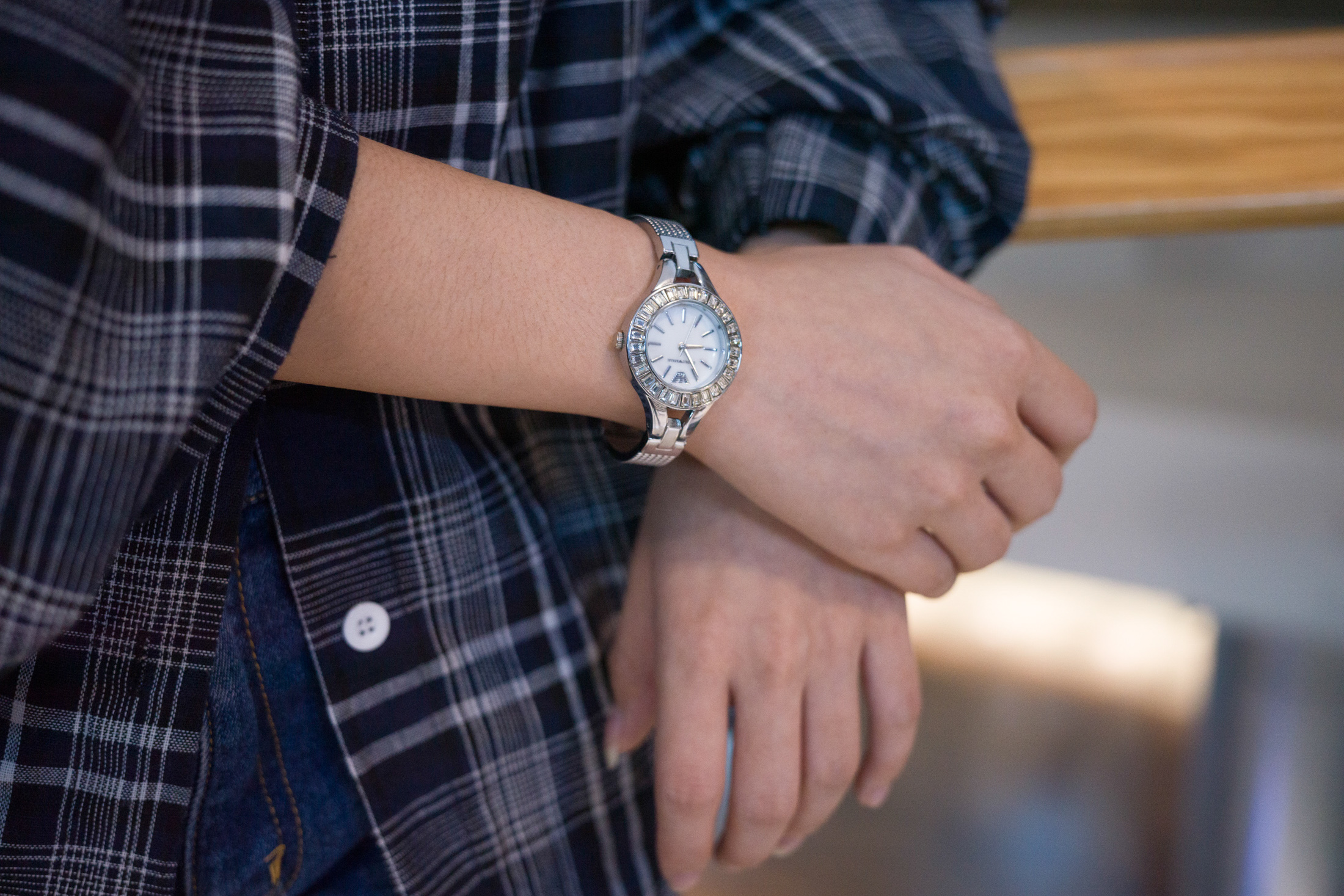 A woman wears a watch. 