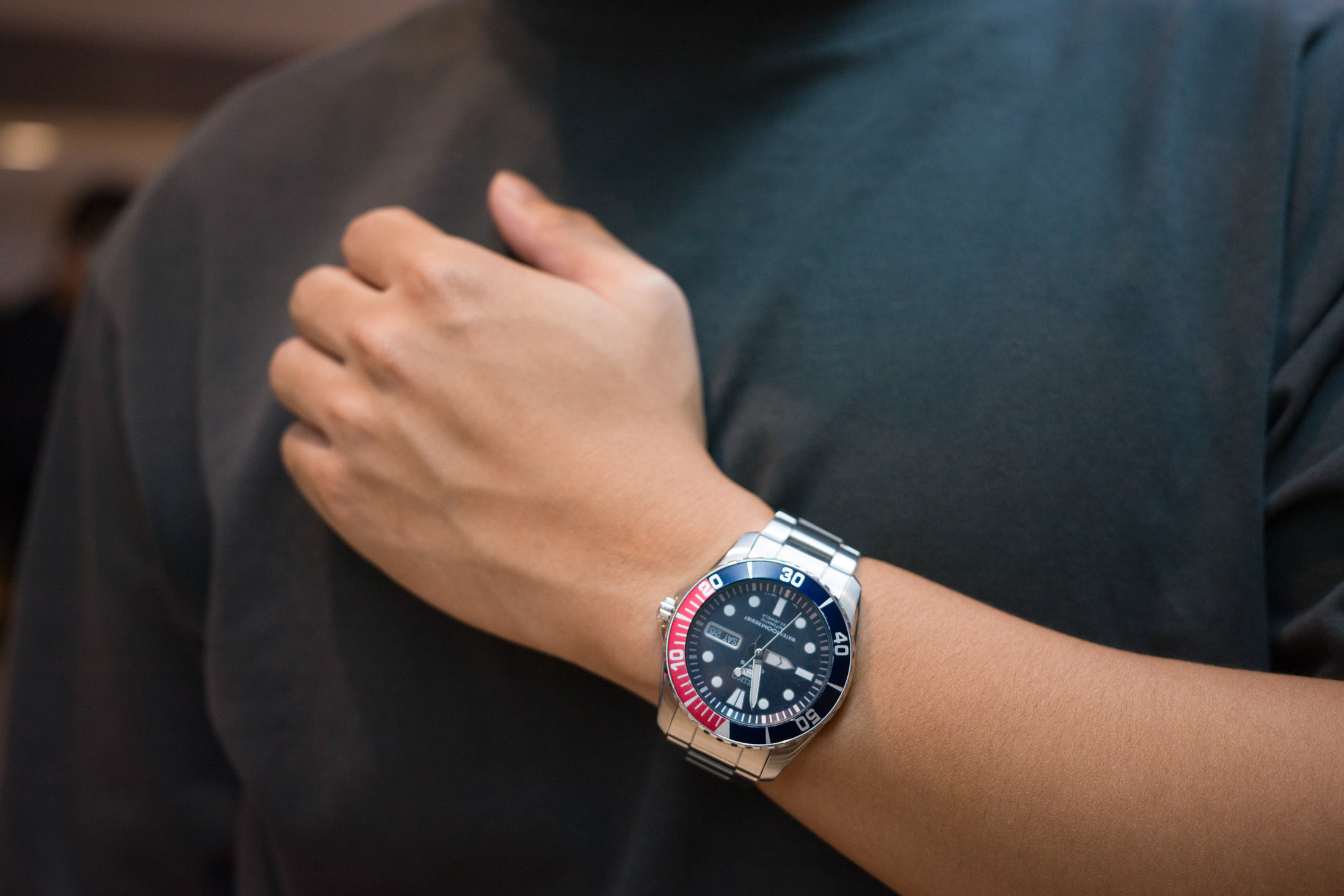 A man wears a watch. 