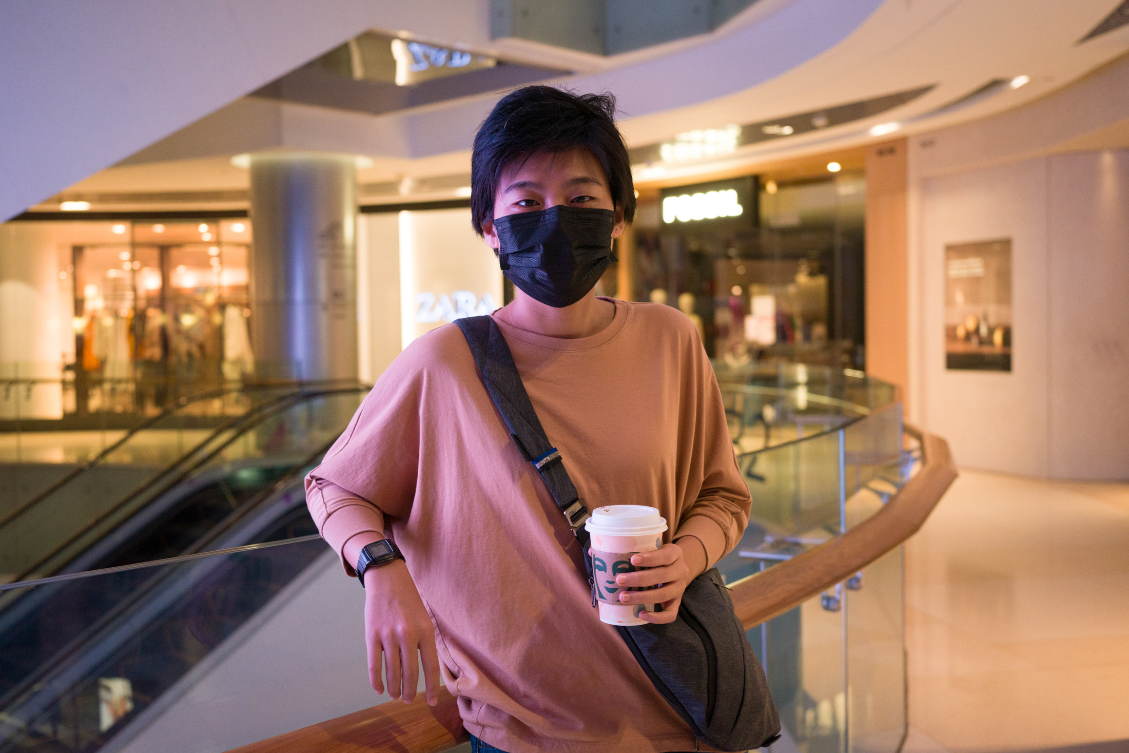 A woman poses while wearing a watch.