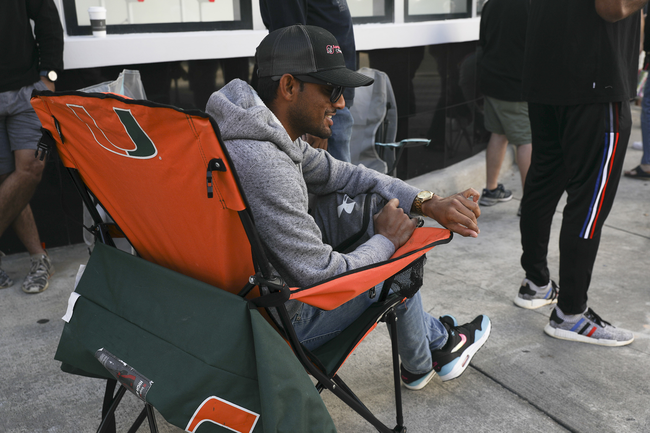 A man poses while wearing a watch.