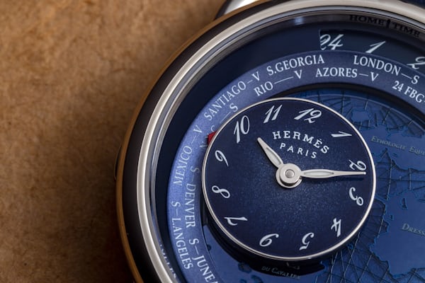 Arceau Le Temps De Voyageur blue model dial closeup