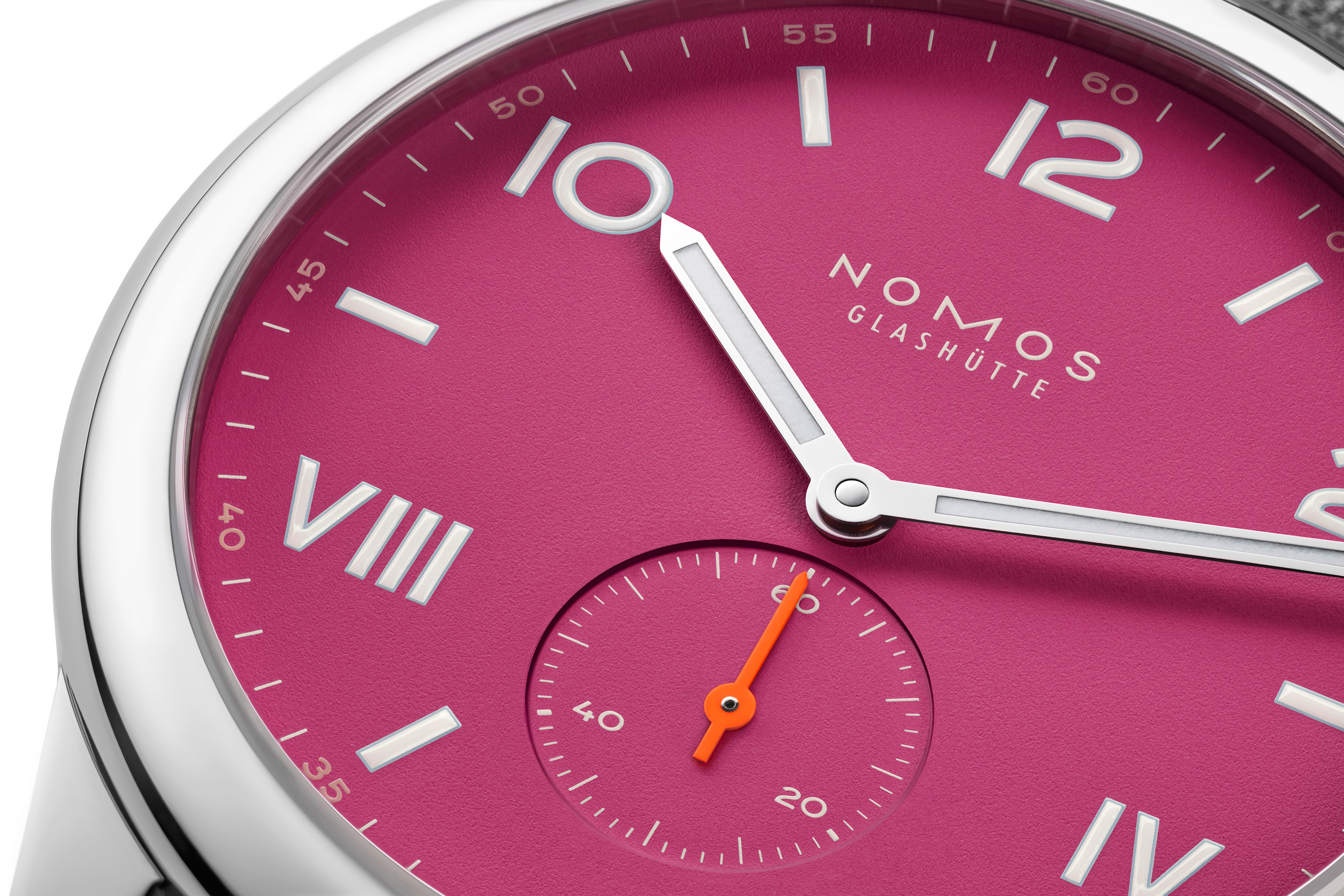 A close-up on the dial of the new NOMOS Club Campus Deep Pink.