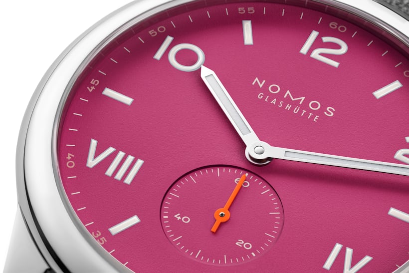 A close-up on the dial of the new NOMOS Club Campus Deep Pink.