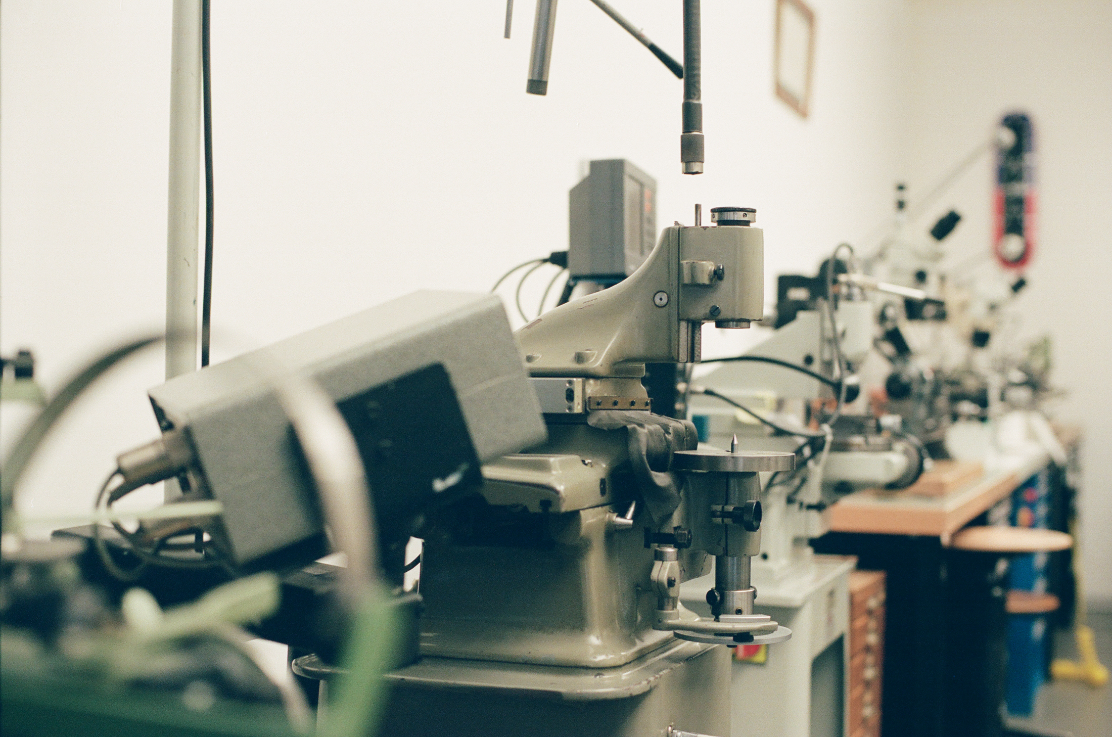 Watch making equipment pictured here with skateboard deck in far distance. 