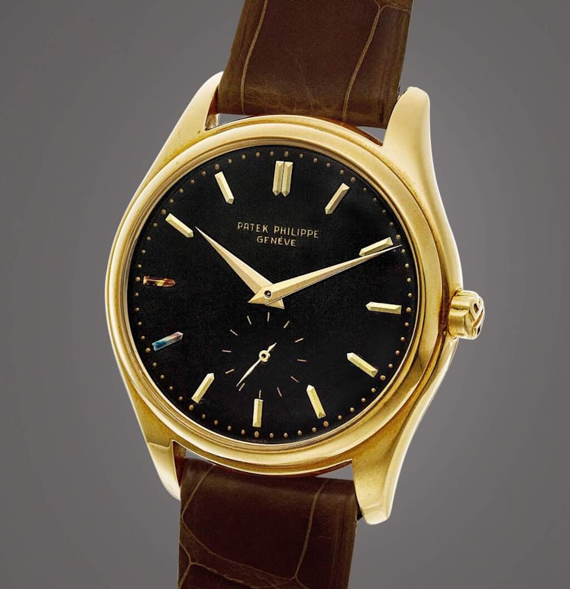 Patek Philippe Reference 2526 | A very well preserved yellow gold wristwatch with black enamel dial, Circa 1953