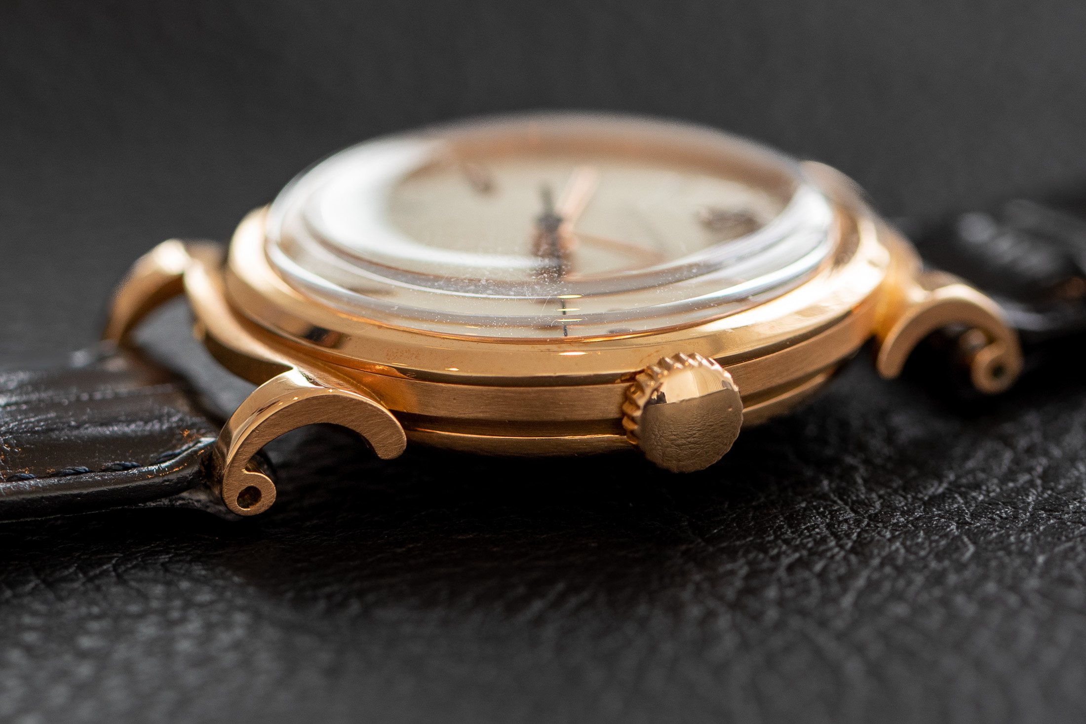Patek Philippe Reference 1491 | A well preserved pink gold wristwatch with indirect centre seconds, hard enamel dial and scrolled lugs, Made in 1947