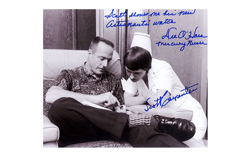 Signed photograph by Carpenter of Glen showing the watch to a nurse.