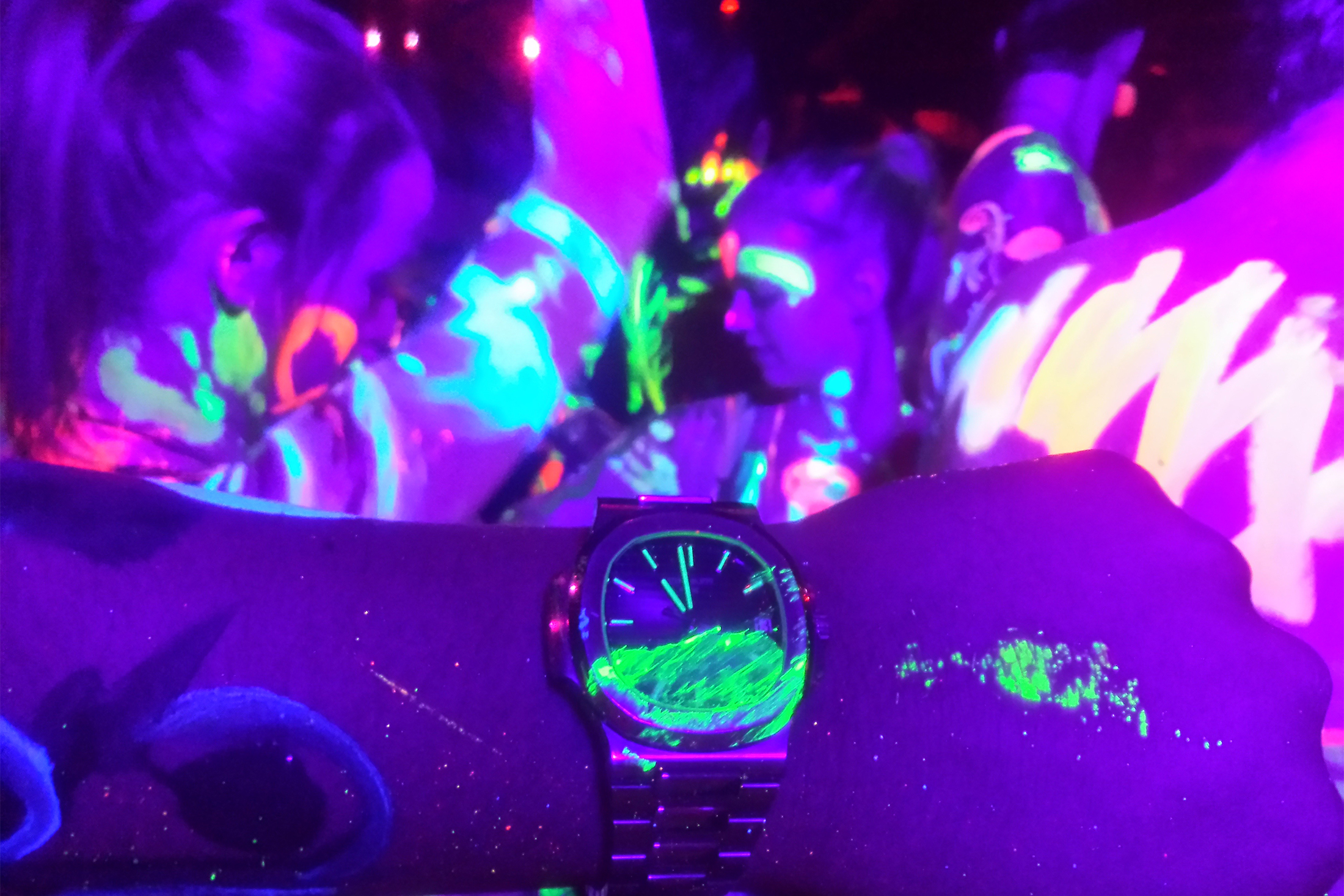 A man wears a Patek Philippe 5711 Nautilus with Tiffany stamp