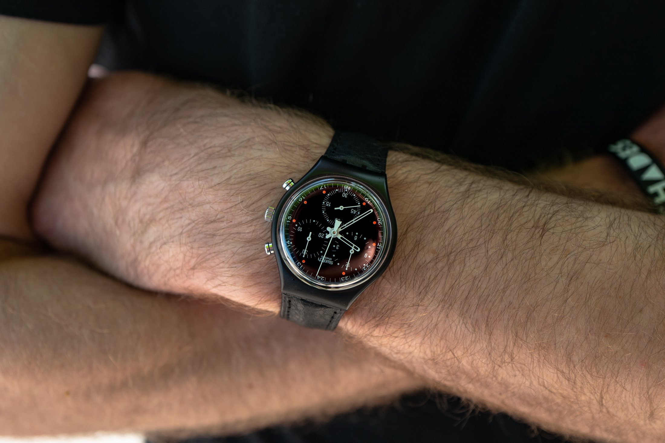 a black swatch chronograph. 
