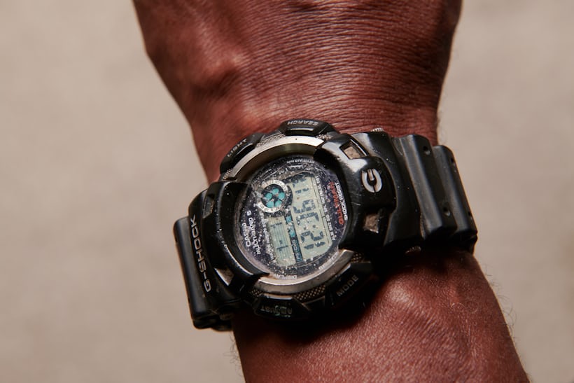 A man wears a weathered G-Shock Gulfman on his wrist.