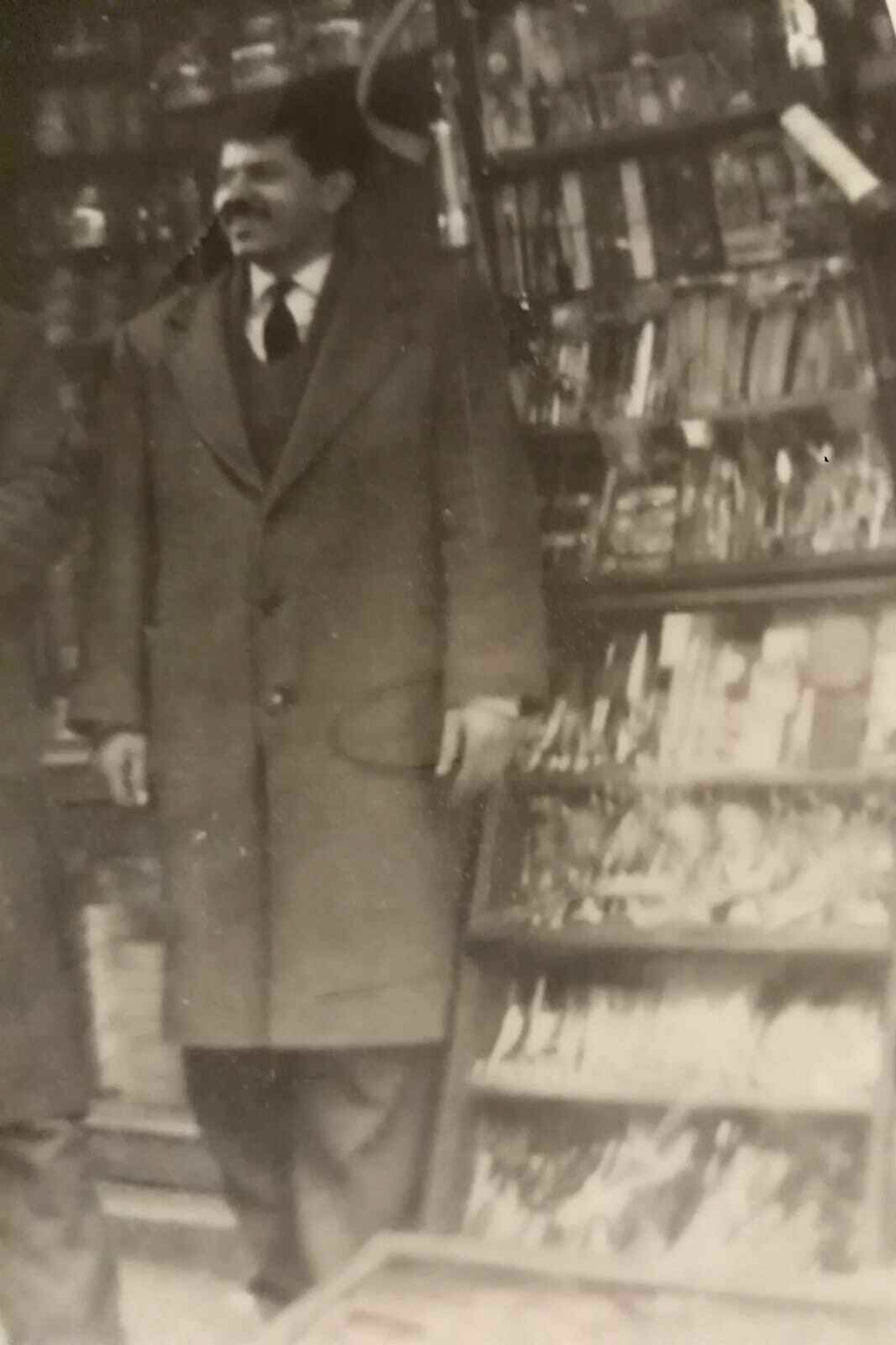 A man in front of a watch stall 