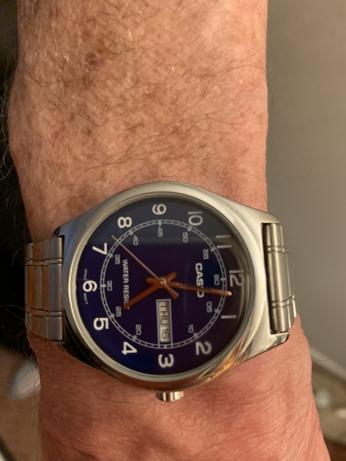 A Casio watch on a wrist 