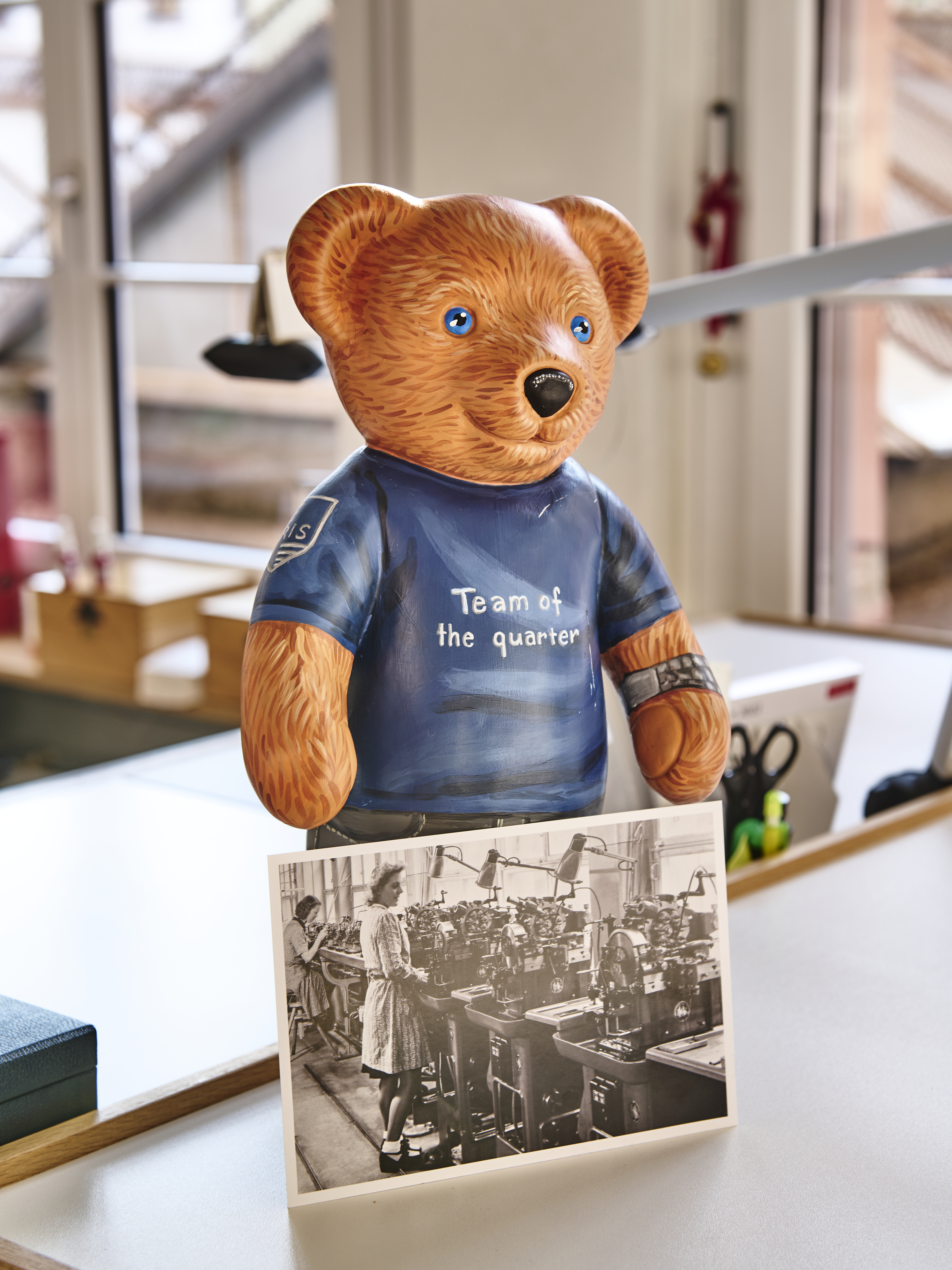 A toy bear and a black and white photograph