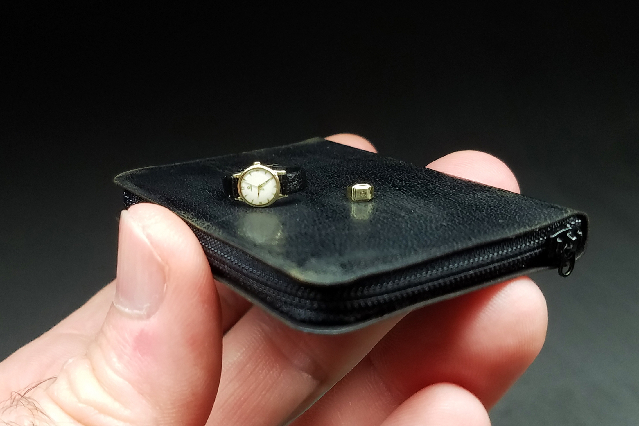 Tiny Omega resting on its side