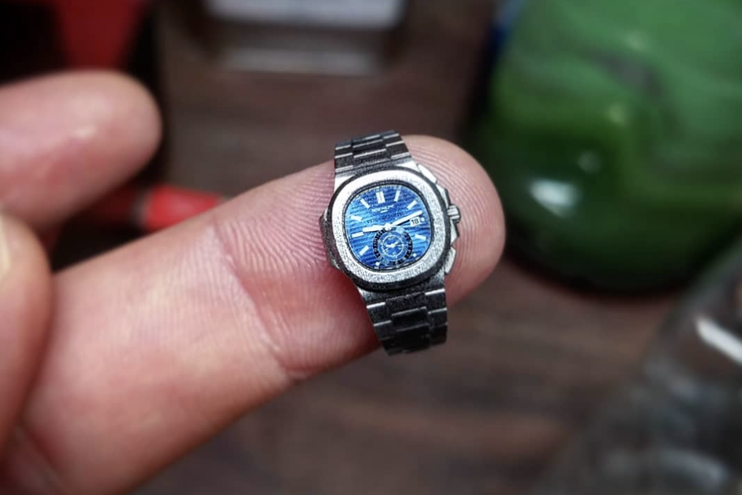 Tiny Patek Nautilus on a finger