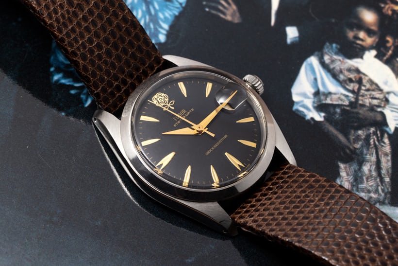 A Tudor watch on a brown strap