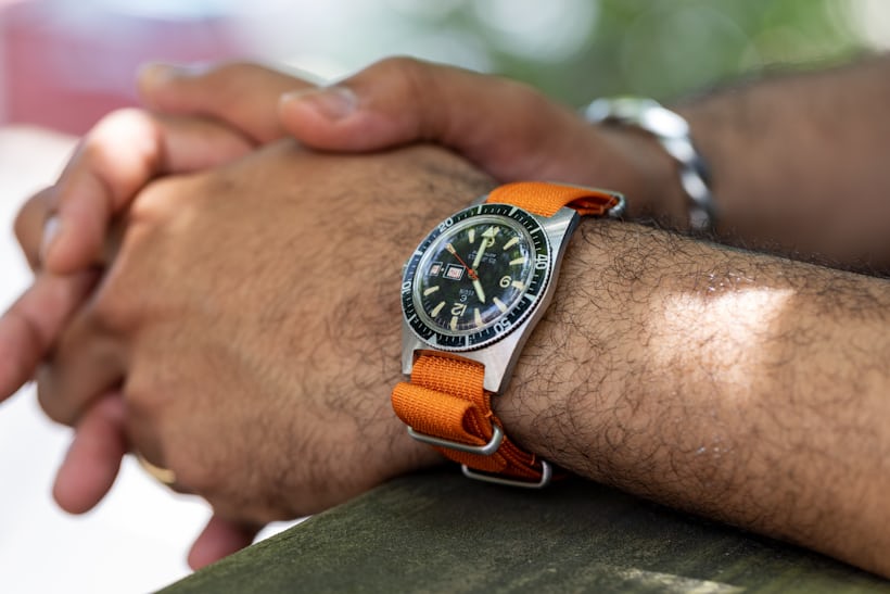 An Elgin watch on an orange strap