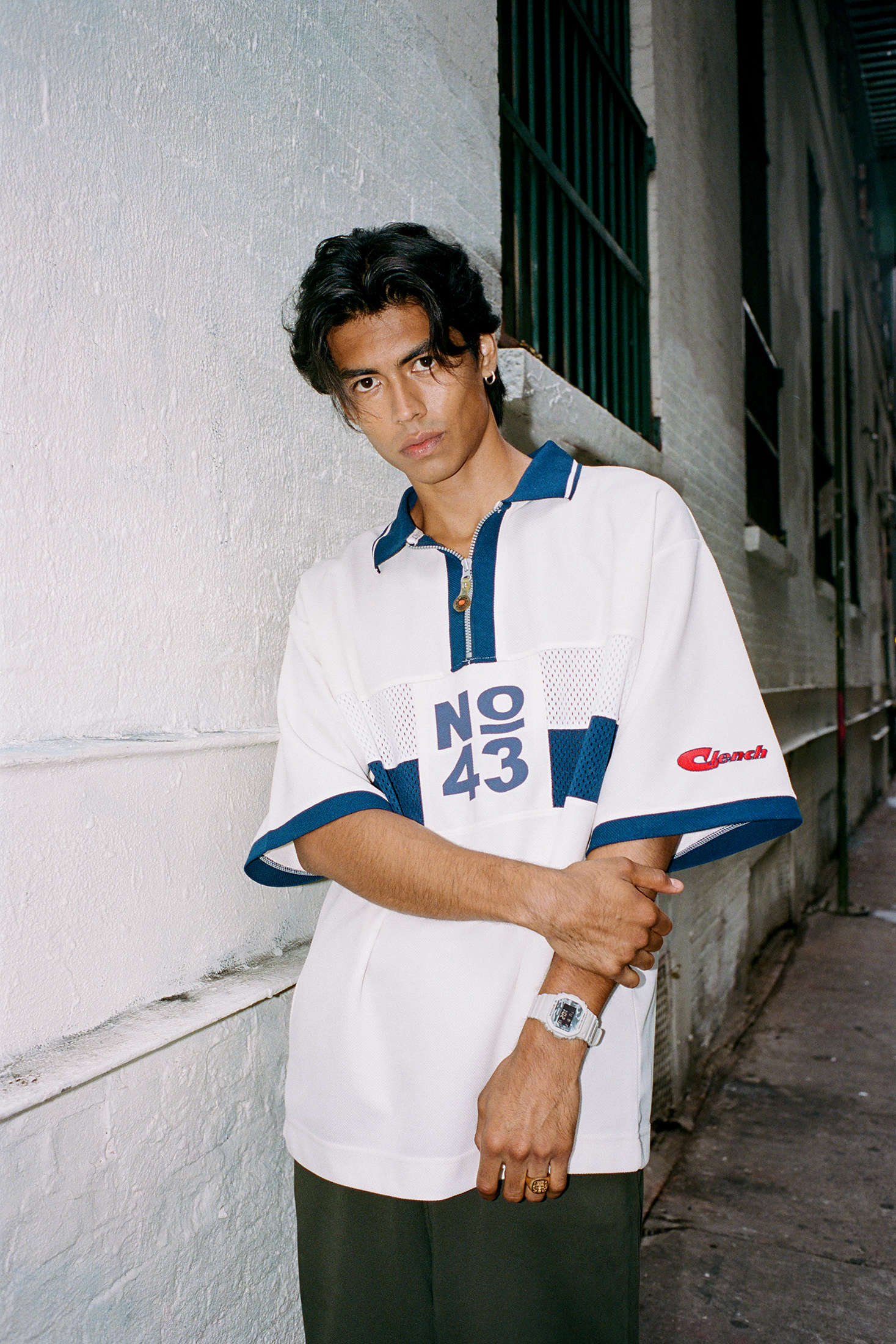 Man in front of wall.