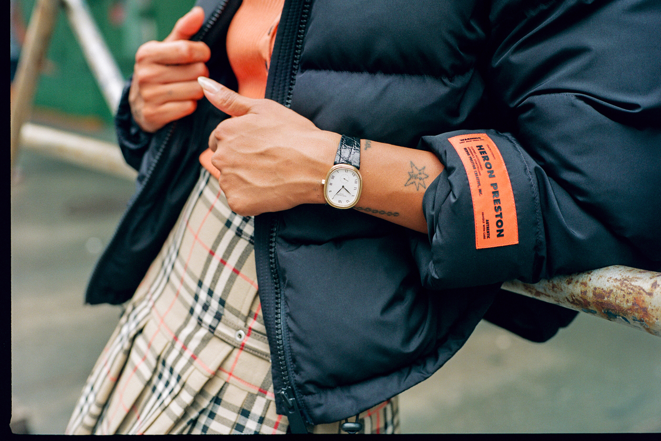 Model leaning against rail