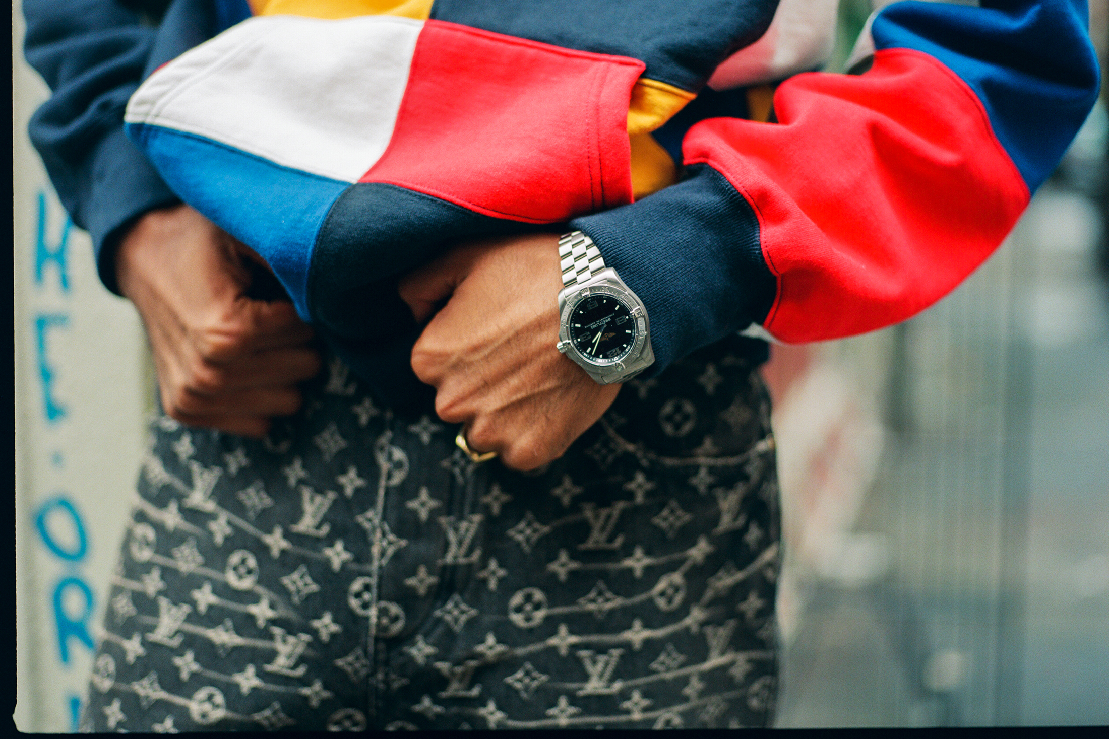 Model holding his pants.