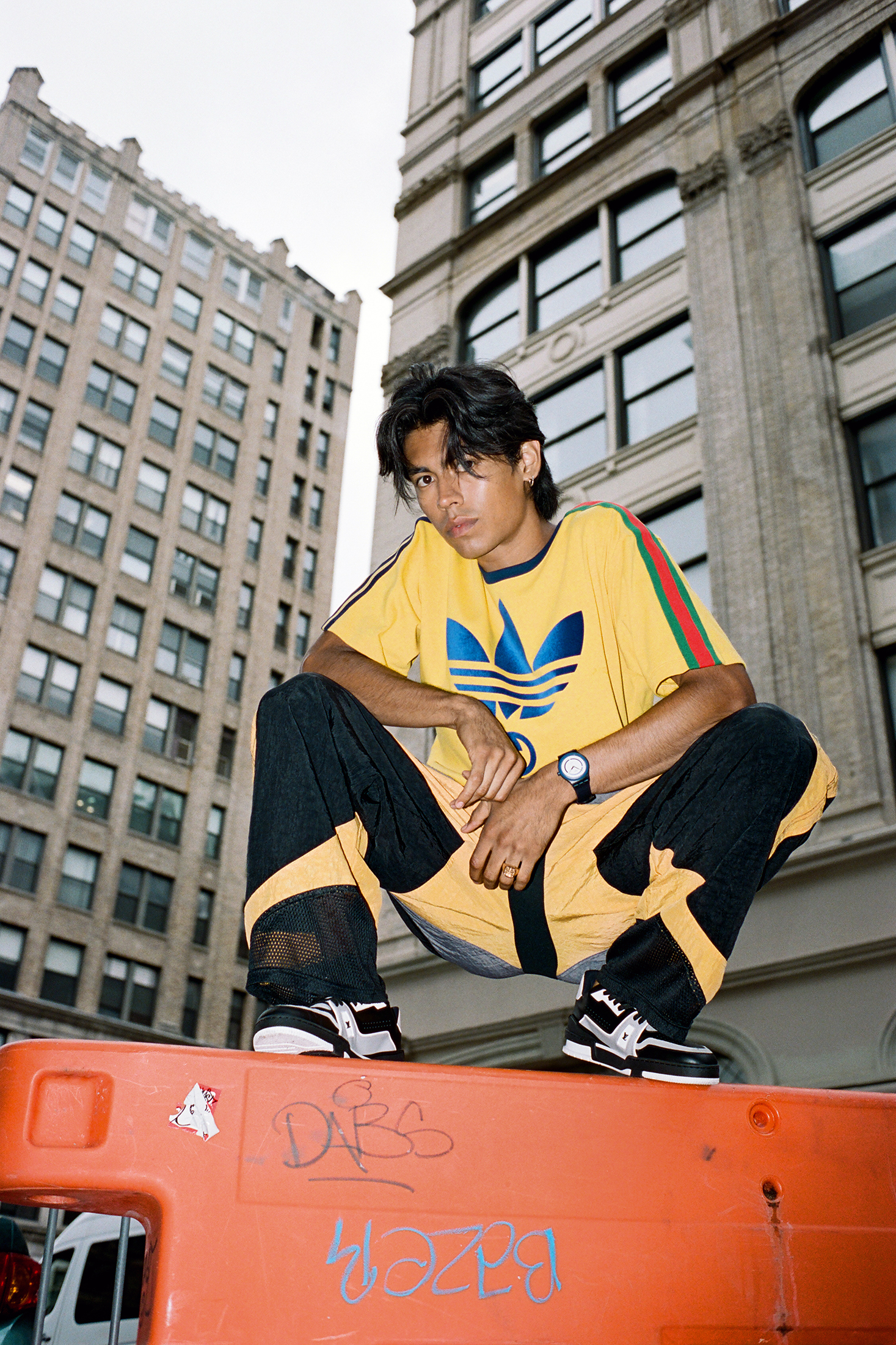 Model posing on a traffic medium.