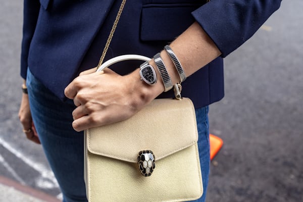 Bvlgari Serpenti on Frances Clift wrist pictured with purse.  
