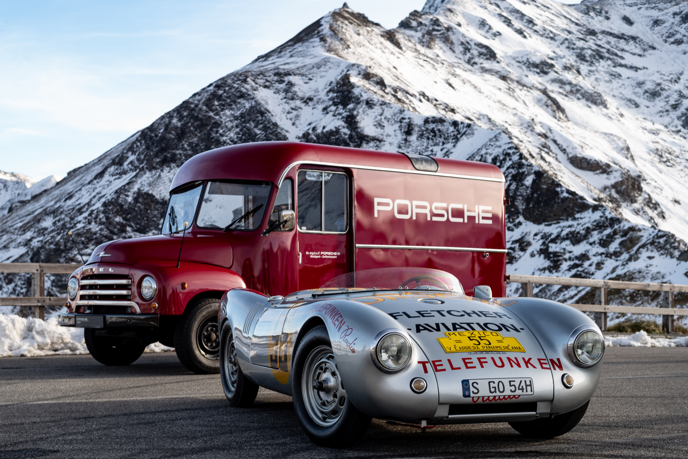a porsche 550 spyder and truck