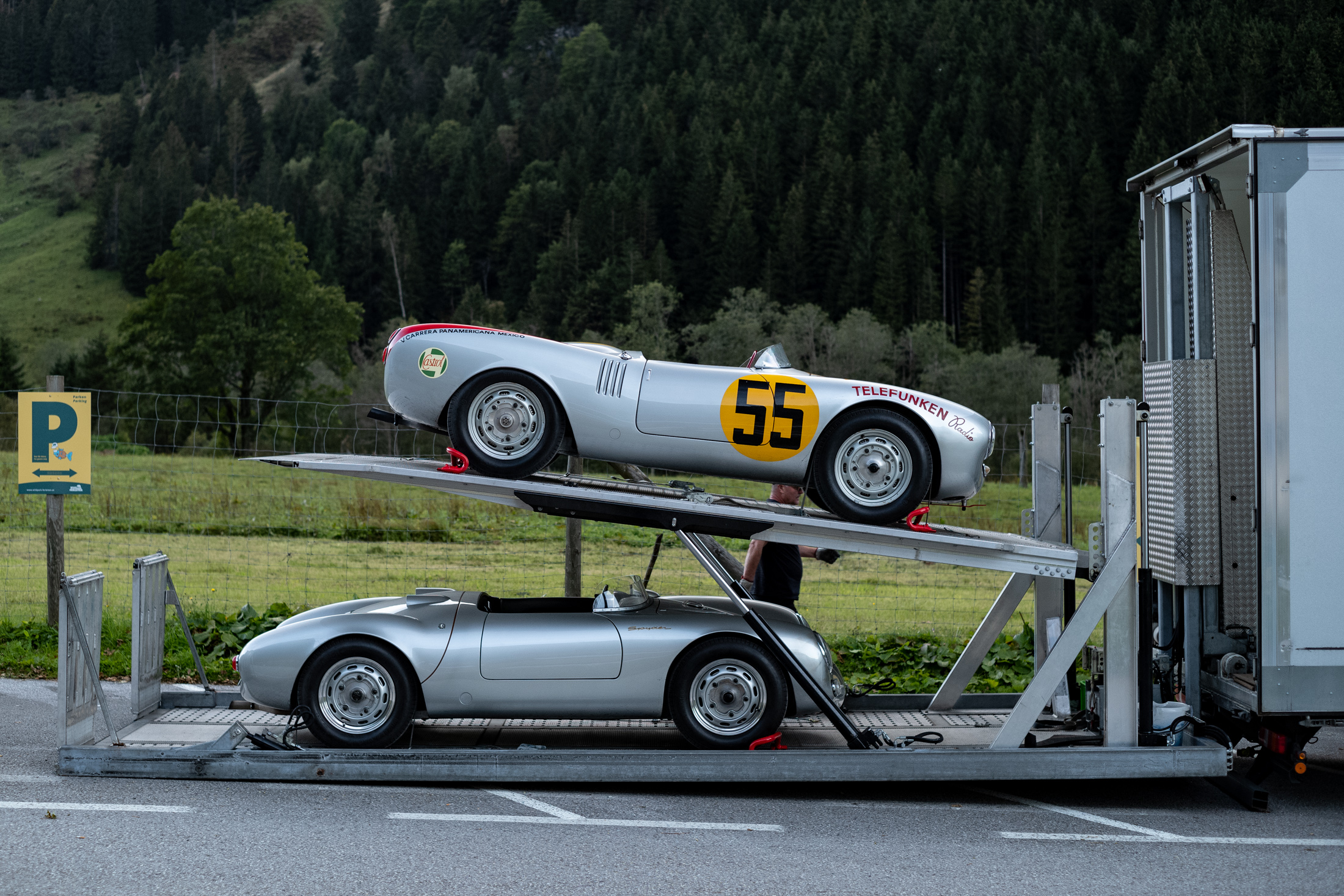 two porsche 550s on a car carrier