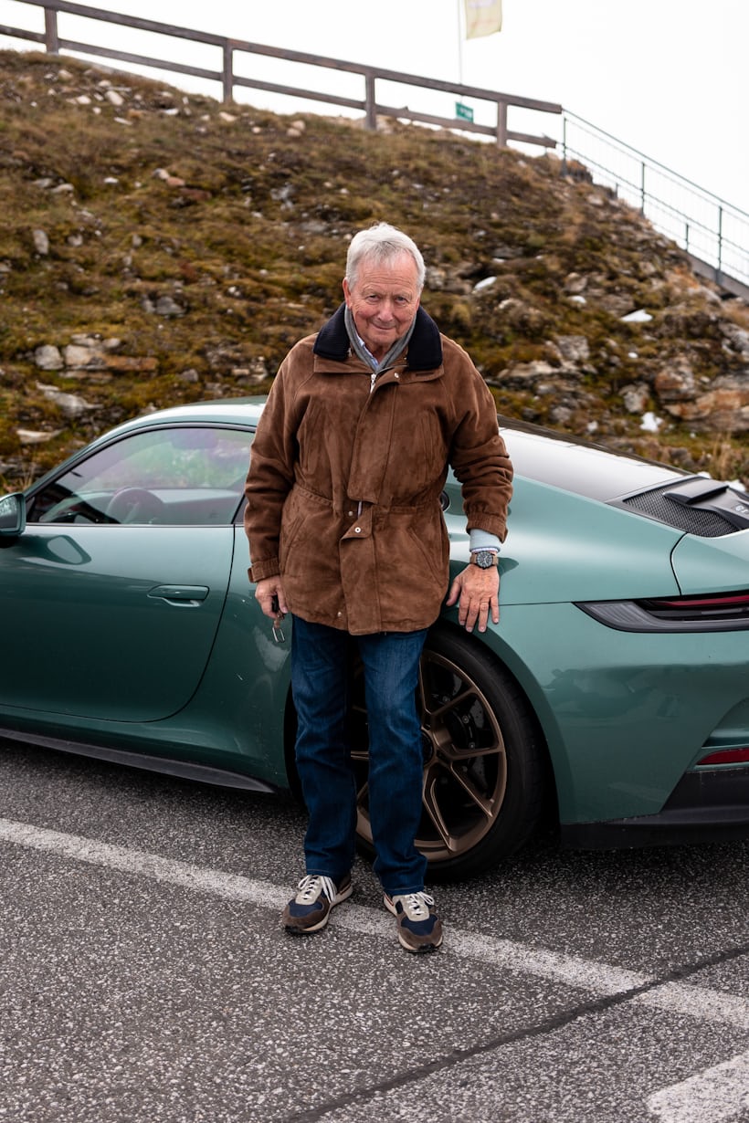 dr porsche with his watch and car