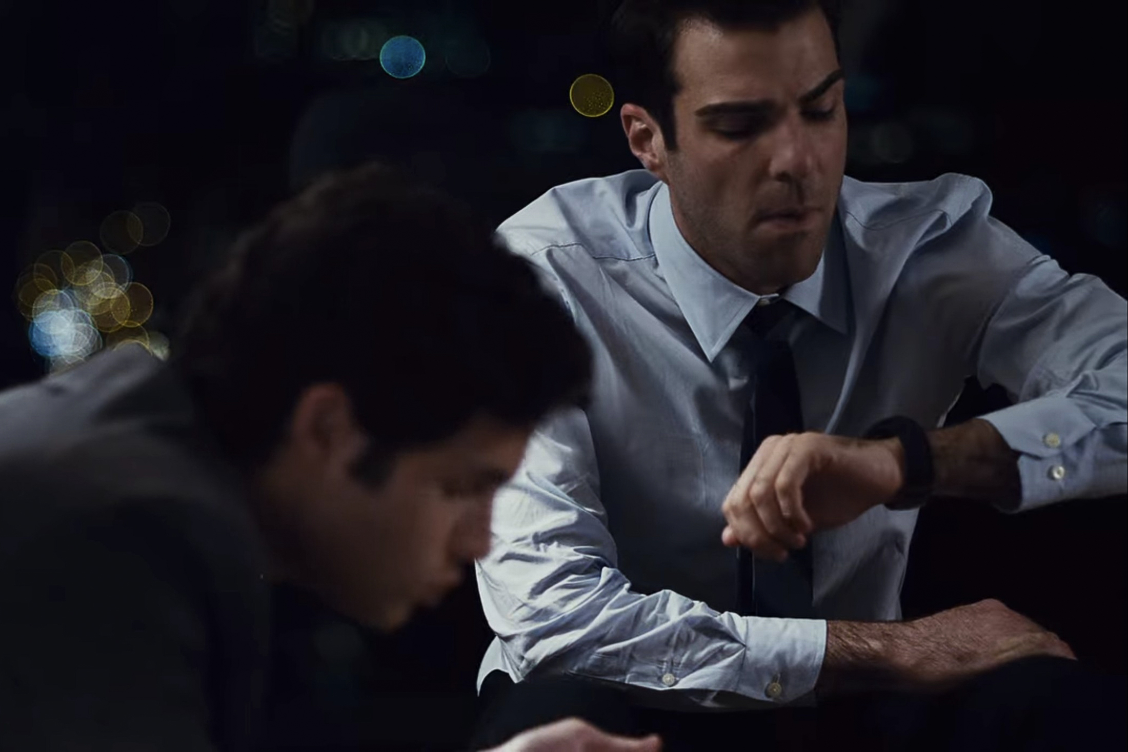 Quinto checks the time