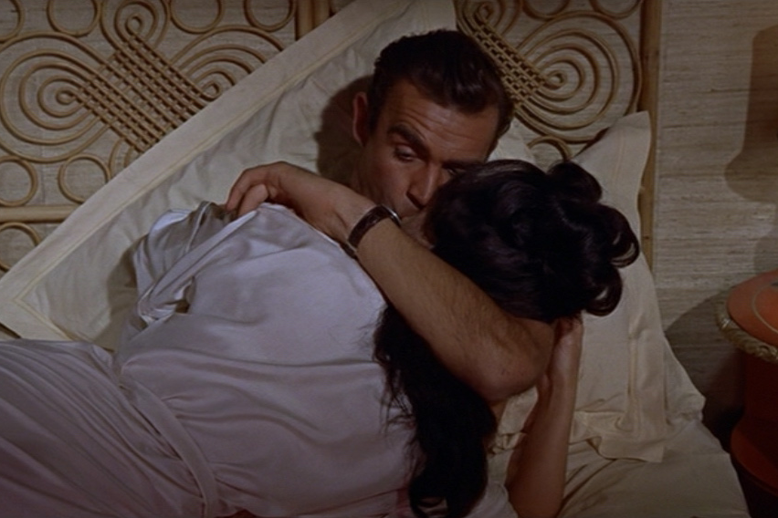 James Bond looks at his watch