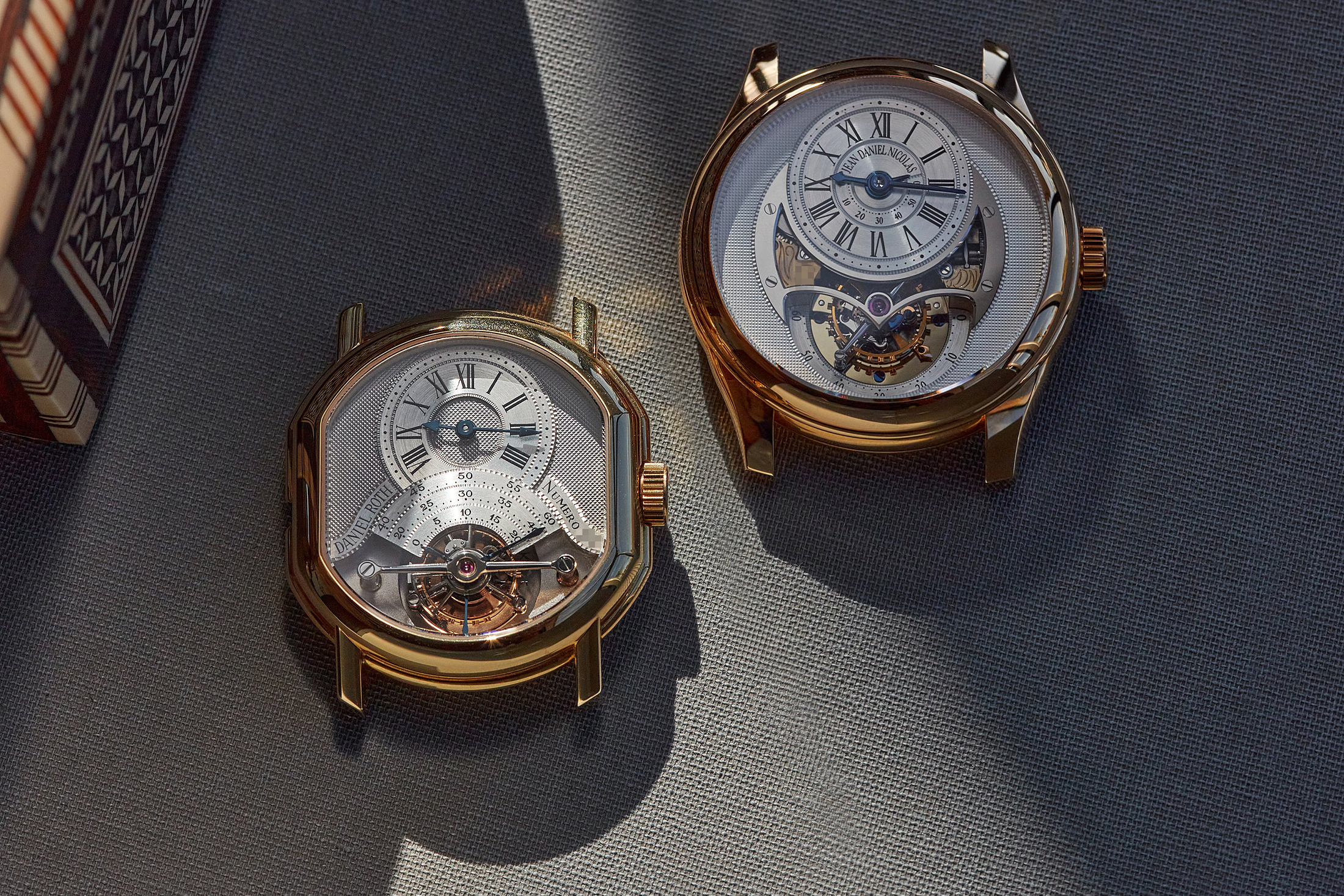 An early Roth tourbillon with one of his more contemporary pieces made under the Jean Daniel Nicolas name.