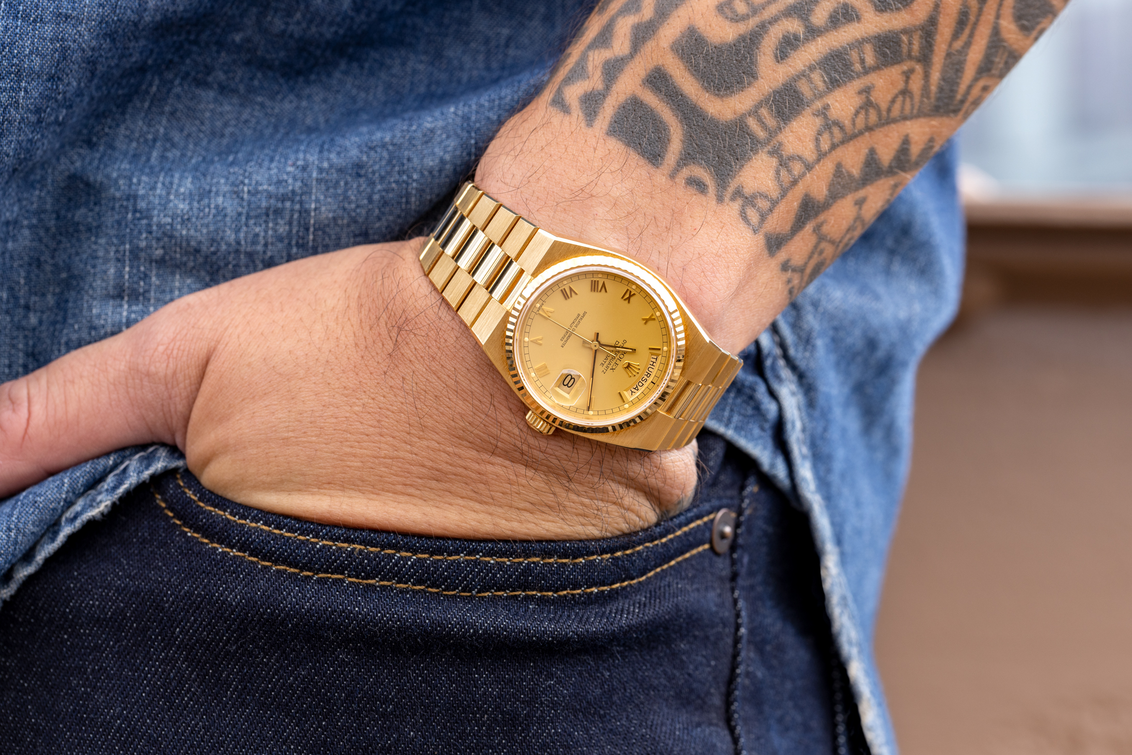 A rolex day-date oysterquartz