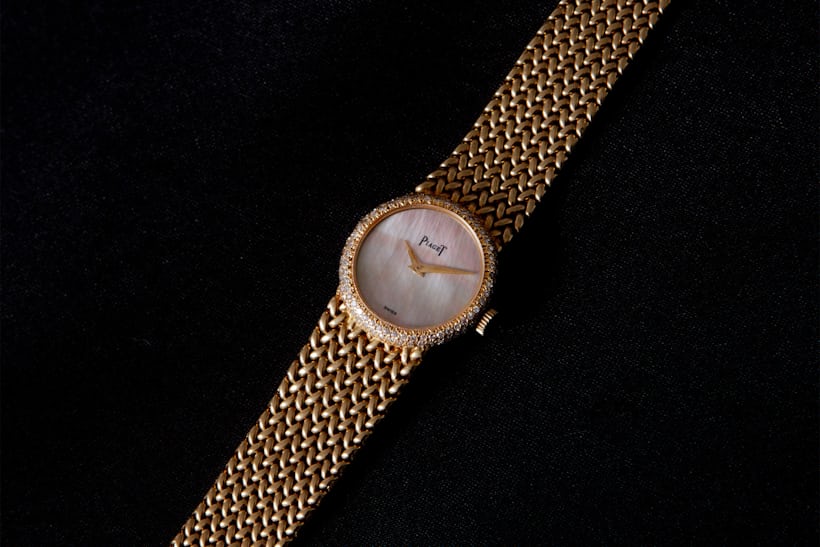 small gold watch