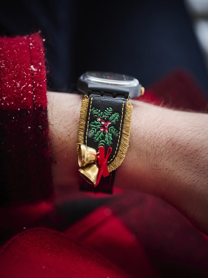 The Swatch Golden Merry Christmas sweater watch strap