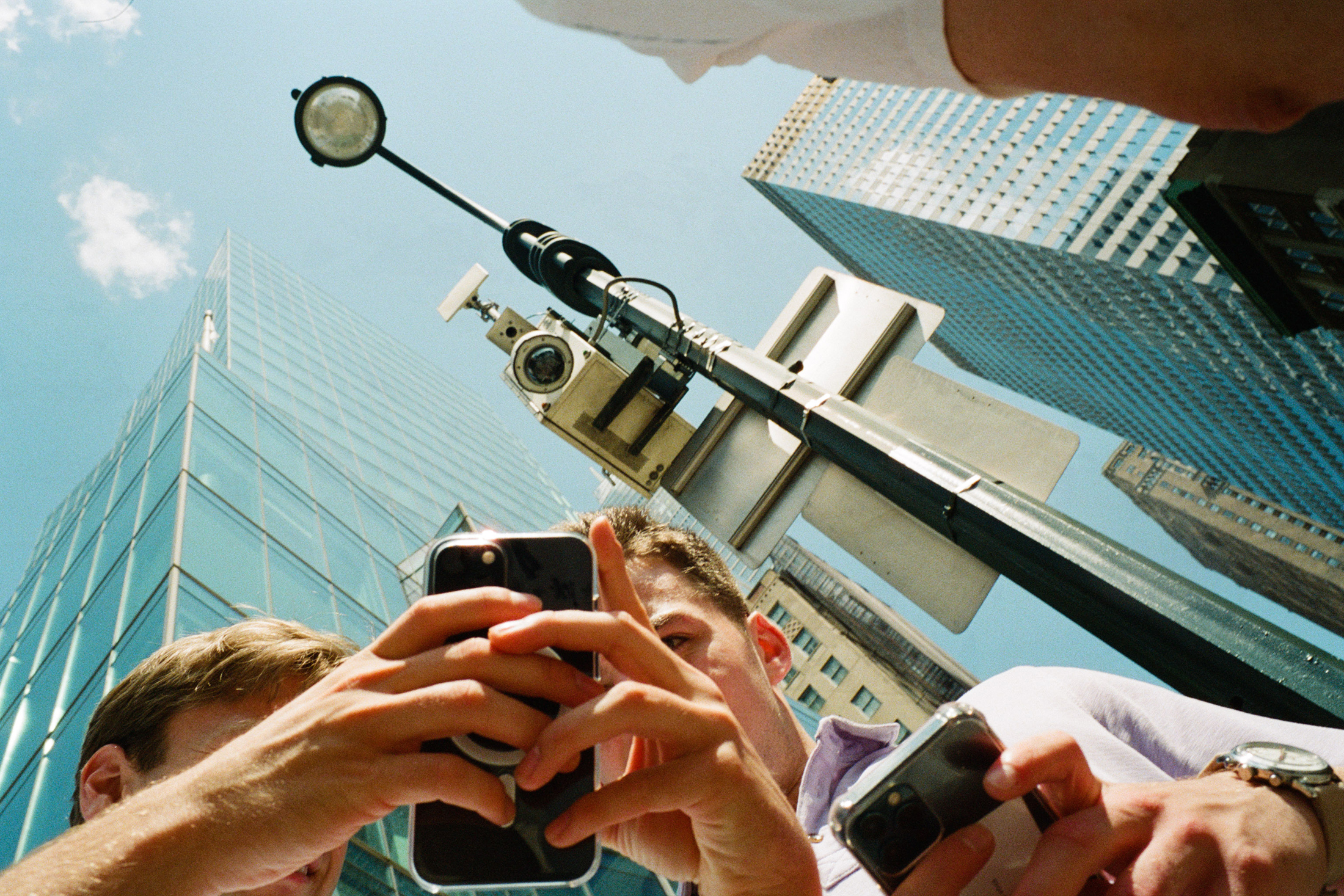 People looking at a phone.