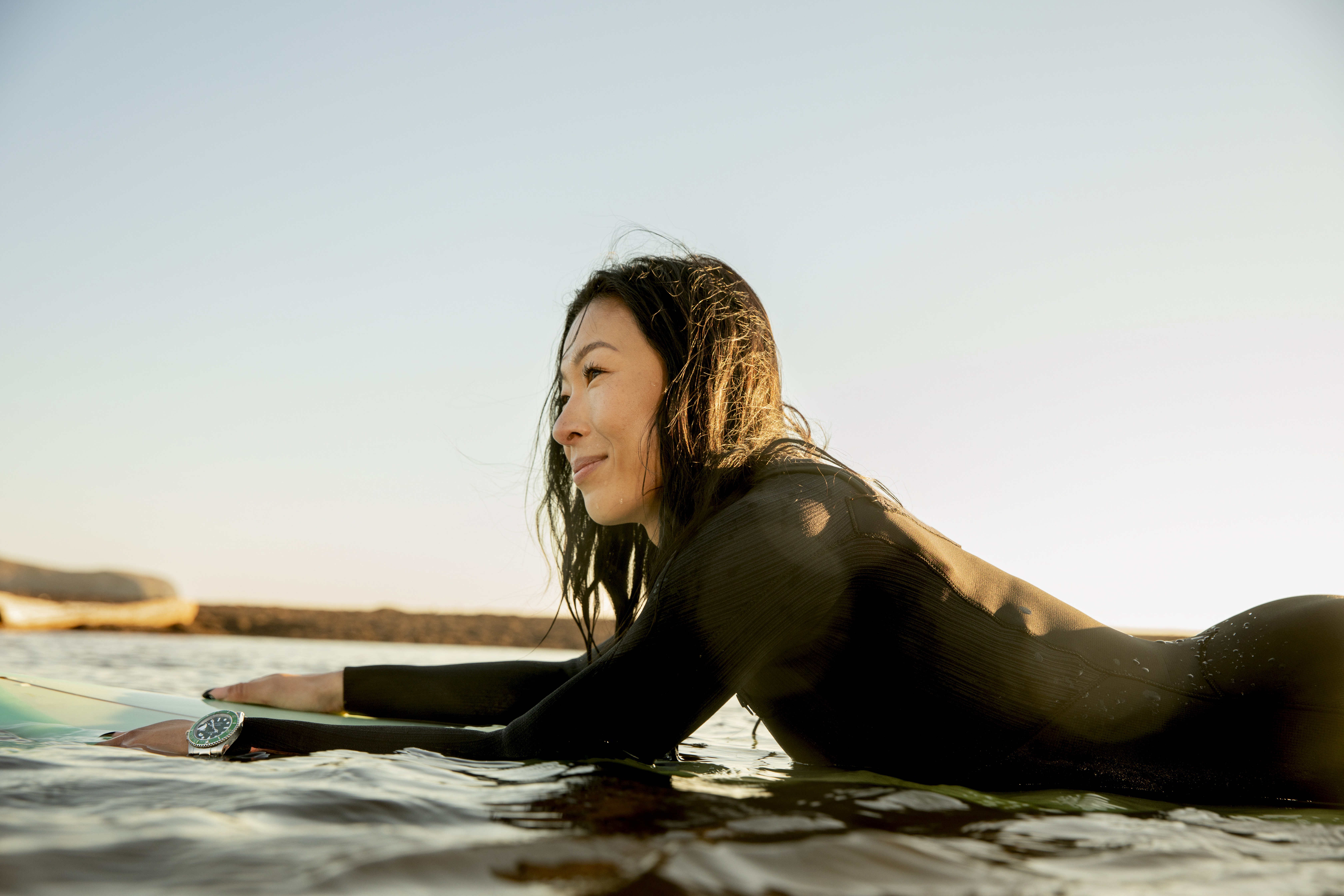 Woman on surfboard.