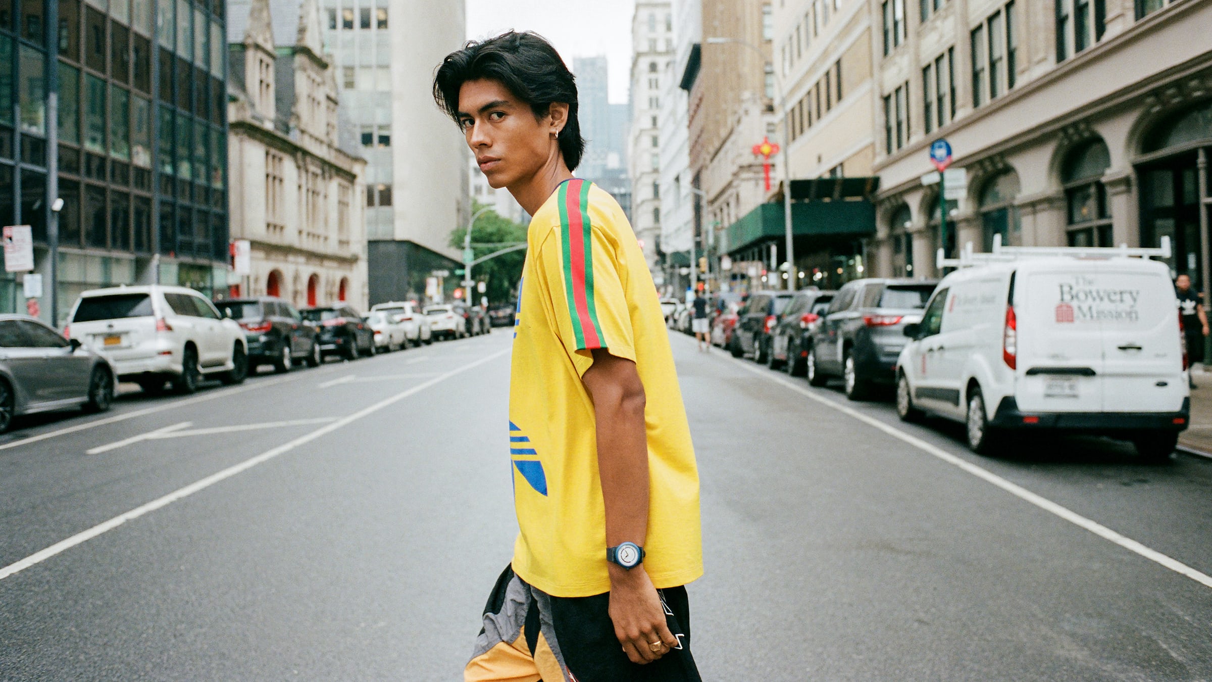 Man walking across street.