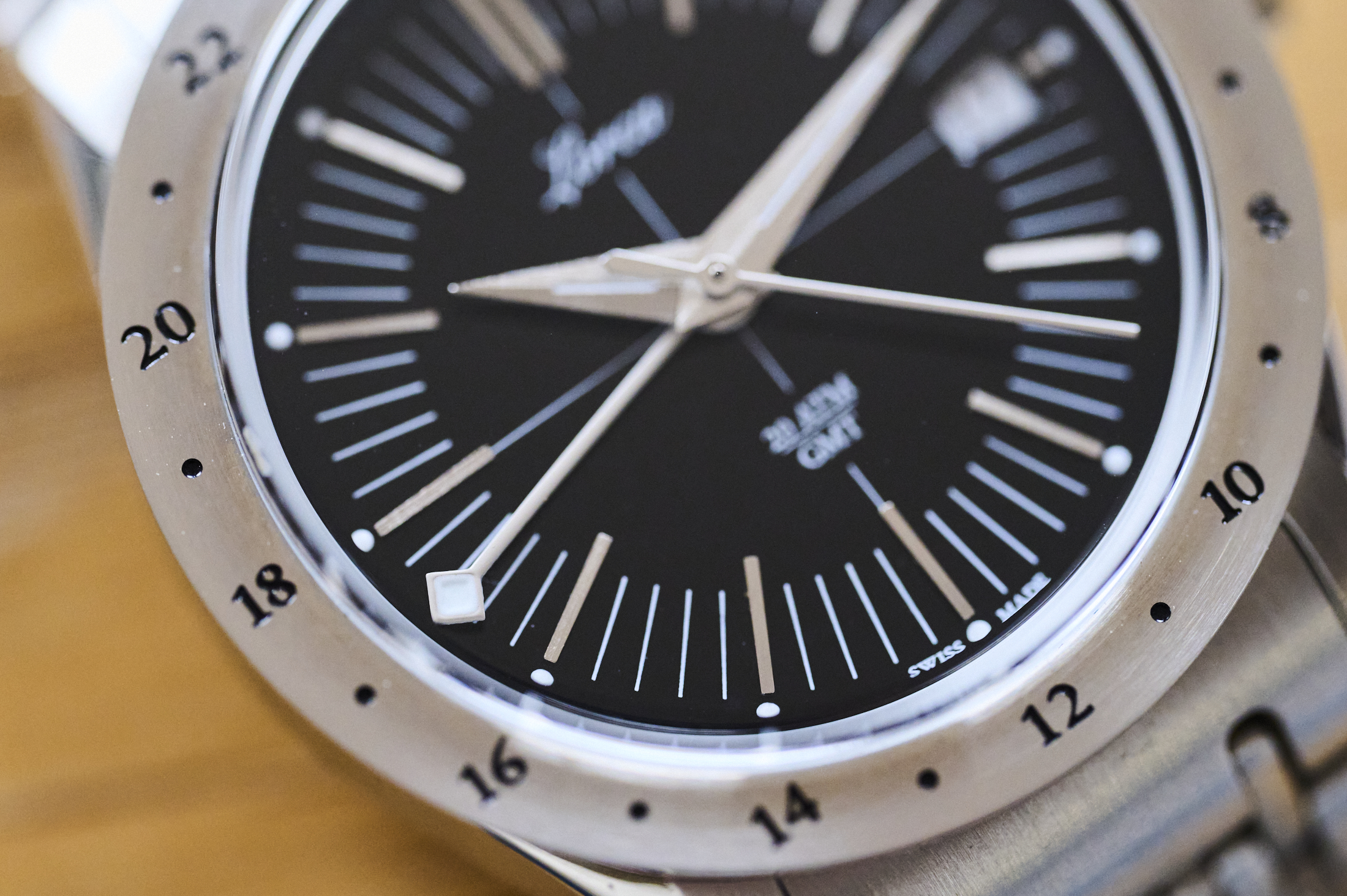 close up of lorca watch dial GMT hand